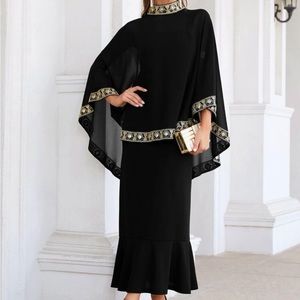 Black dress with poncho that has gold design. Both are included. size small